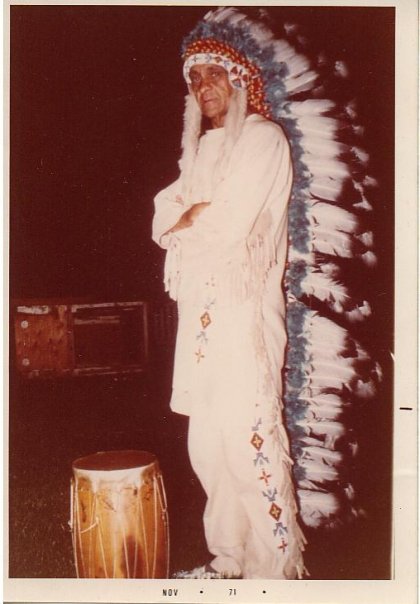 "Smitty" standing in full ceremonial Sioux Native costume in 1971