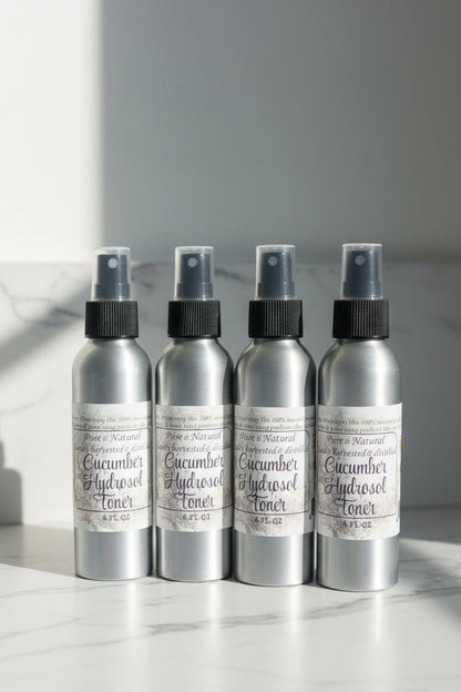 Four spray bottles labeled Cucumber Hydrosol Skin Toner, arranged side by side.