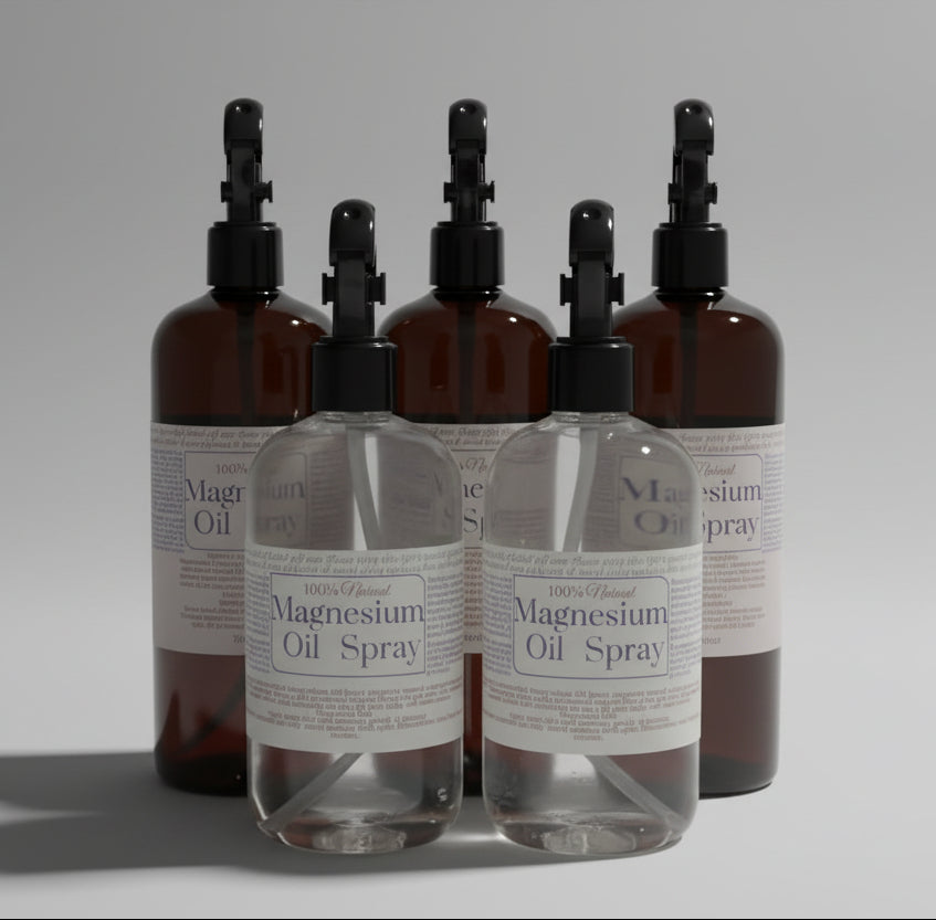 Bottles of magnesium oil spray with labels on a light surface