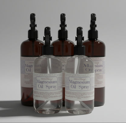 Bottles of magnesium oil spray with labels on a light surface