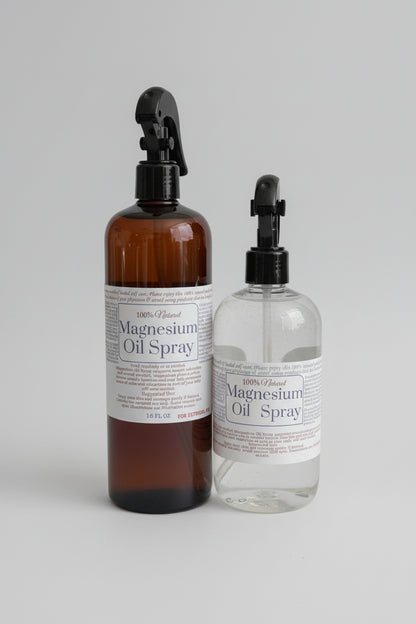 Two bottles of magnesium oil spray on a light background